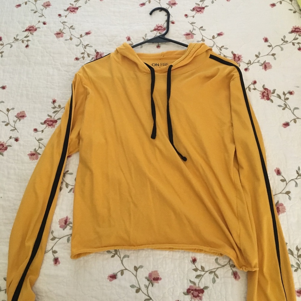 Yellow pullover with a black stripe on the sleeve